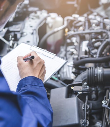 Auto check, car service shop concept. Automobile repairman writing job checklist on clipboard, mechanic checking engine to estimate repair machine, inspecting maintenance by engineer at vehicle garage