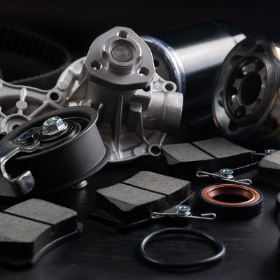 Auto parts spare parts car on black background. Auto parts store. Suspension and engine parts.